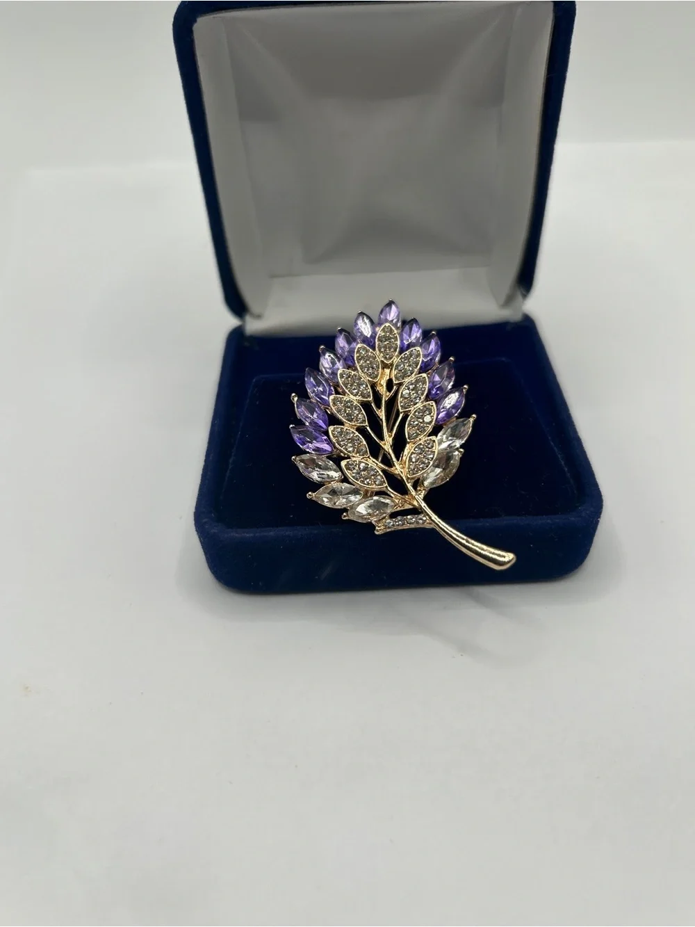 Gold Tone Leaf Brooch with Purple and Clear Faceted Glass Jewels​